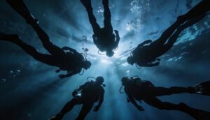 A group of 5 divers as seen from below