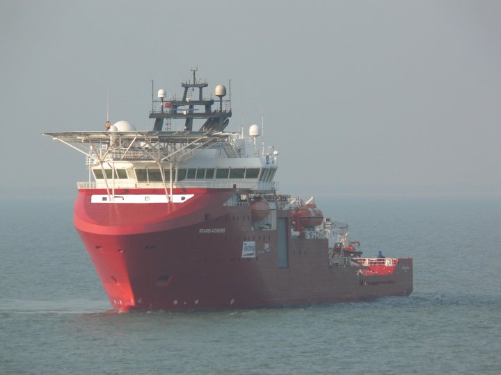 Skandi dive support vessel in the North Sea, red hull commercial diving operations